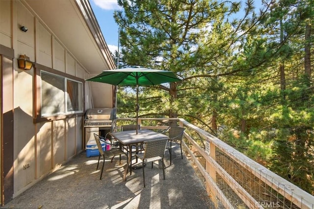 view of patio featuring outdoor dining area and a grill