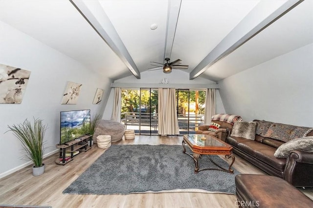 living room featuring lofted ceiling with beams, baseboards, ceiling fan, and wood finished floors