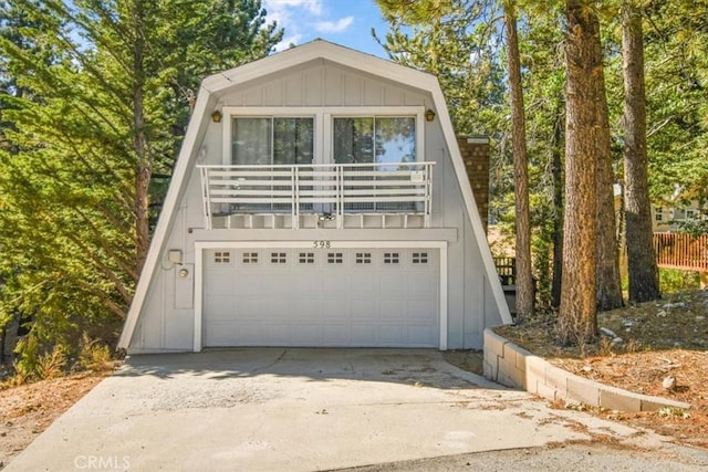 view of front of home with a balcony and board and batten siding