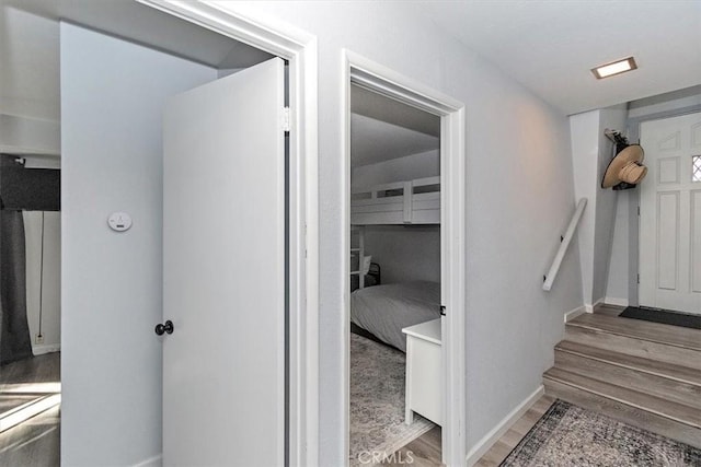 interior space with baseboards and wood finished floors