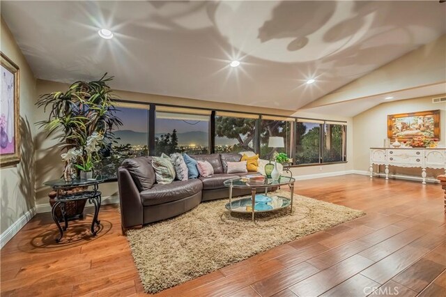 2333 N Coronet Ct, Covina, CA 91724 - living area with baseboards, recessed lighting, wood finished floors, and lofted ceiling