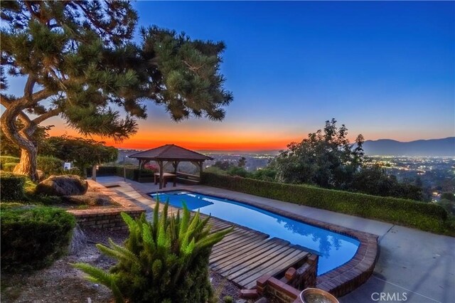 2333 N Coronet Ct, Covina, CA 91724 - pool at dusk featuring a gazebo and an outdoor pool