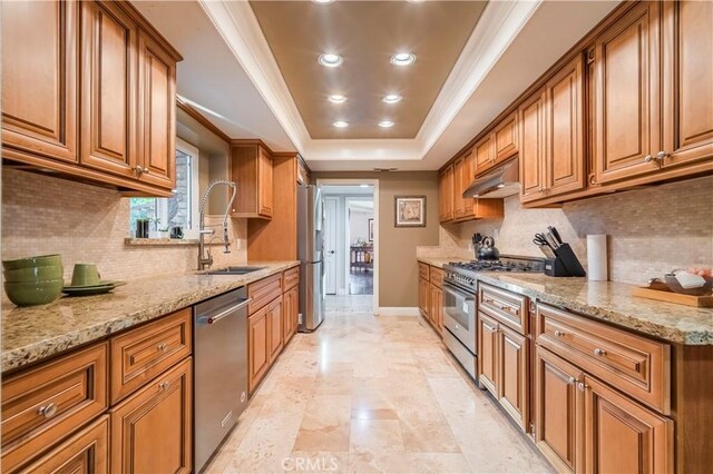 2333 N Coronet Ct, Covina, CA 91724 - kitchen with stainless steel appliances, brown cabinetry, recessed lighting, and ornamental molding