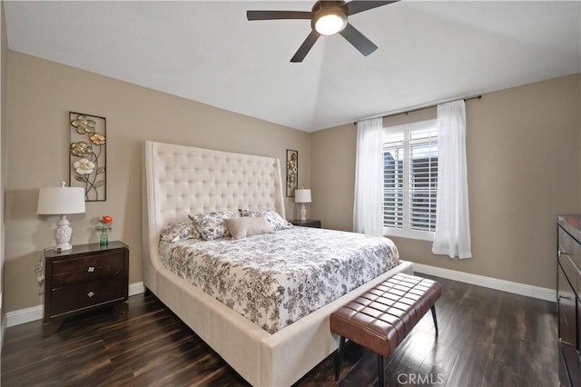 bedroom with lofted ceiling, a ceiling fan, baseboards, and dark wood-type flooring