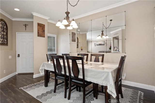 dining space with a chandelier, wood finished floors, baseboards, and ornamental molding