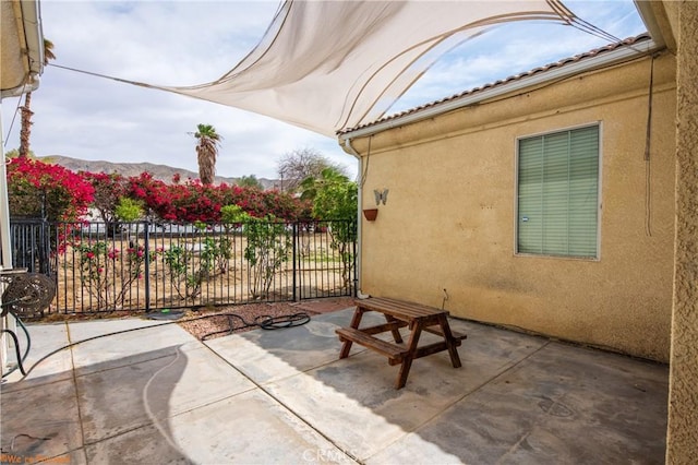 view of patio / terrace featuring fence
