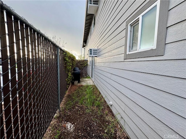 view of side of property with fence