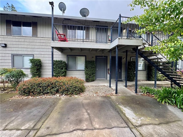 view of front of property with stairway