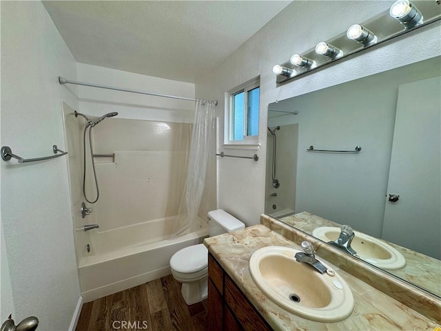 full bath with shower / bath combination with curtain, wood finished floors, vanity, and toilet