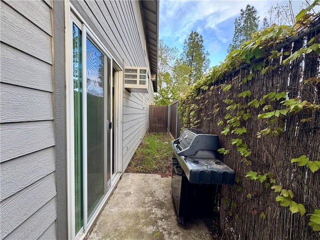 view of side of property with fence