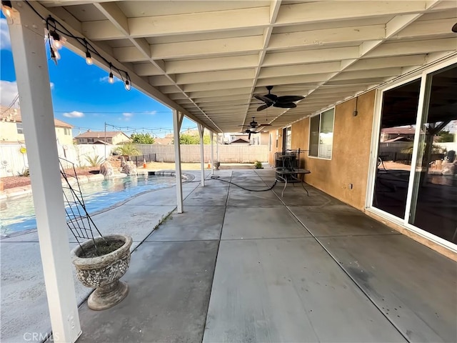 view of patio with a ceiling fan, a fenced backyard, and a fenced in pool