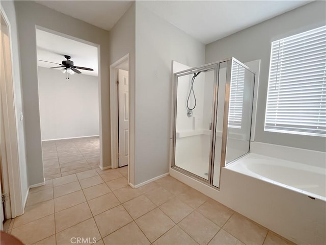 full bathroom featuring a bath, a ceiling fan, tile patterned flooring, and a stall shower