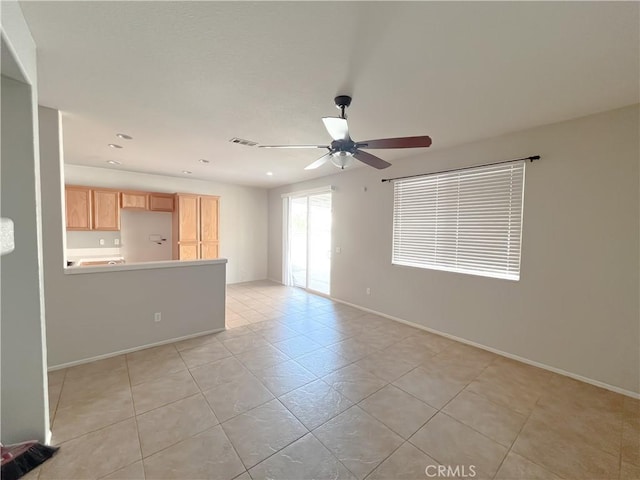unfurnished room with light tile patterned flooring, ceiling fan, baseboards, visible vents, and recessed lighting