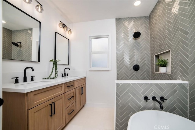 full bath featuring double vanity, a freestanding bath, a walk in shower, and a sink
