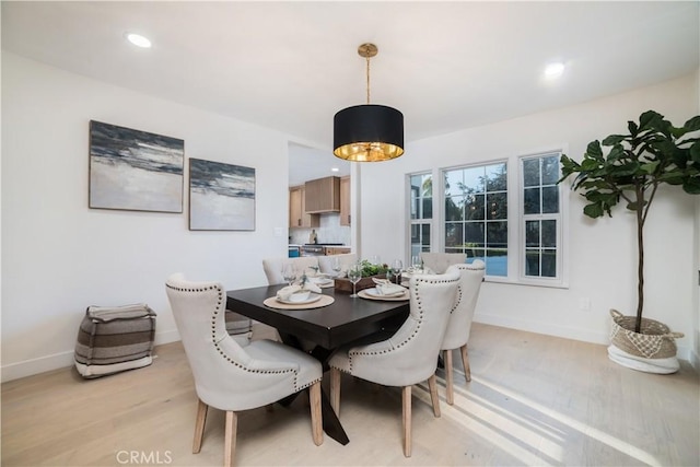 dining area with recessed lighting, baseboards, and light wood-type flooring