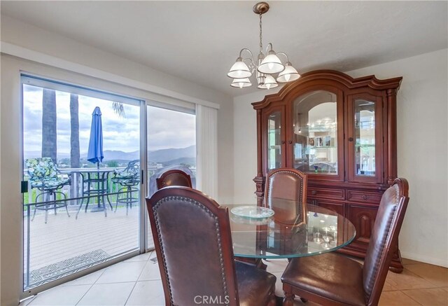 10549 Queen Ave, La Mesa, CA 91941 - dining area featuring baseboards, light tile patterned flooring, and a chandelier