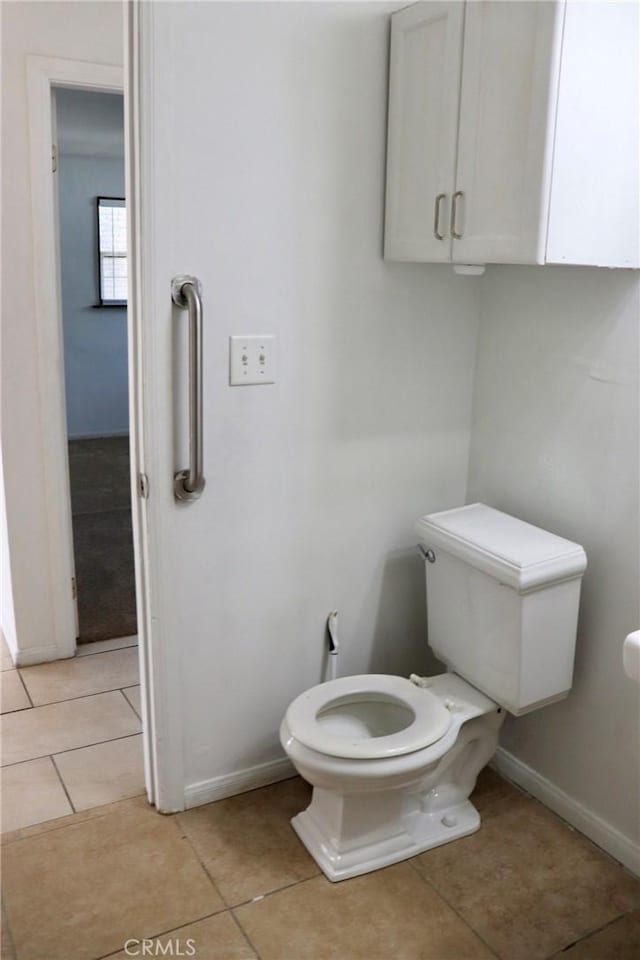 16226 Pine St, Hesperia, CA 92345 - bathroom featuring toilet, tile patterned floors, and baseboards