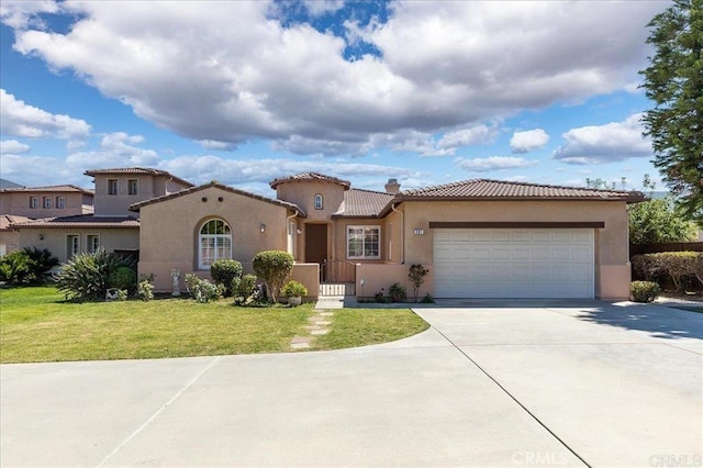 391 Camino Carta, San Marcos, CA 92078 - mediterranean / spanish-style home featuring a tiled roof, stucco siding, a front yard, an attached garage, and driveway
