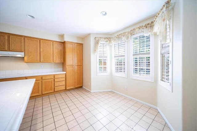 391 Camino Carta, San Marcos, CA 92078 - kitchen featuring recessed lighting, under cabinet range hood, baseboards, and tile counters