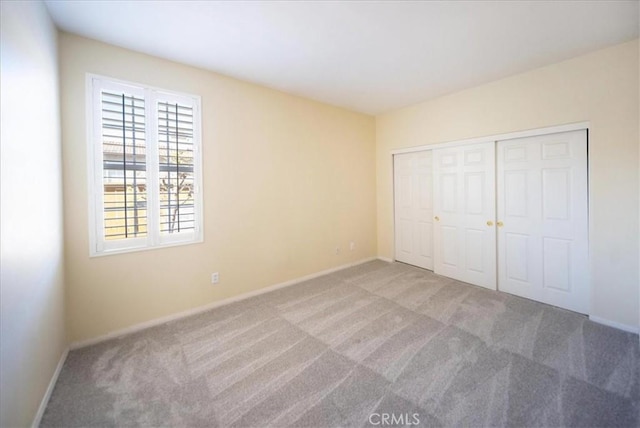 391 Camino Carta, San Marcos, CA 92078 - unfurnished bedroom featuring a closet, carpet, and baseboards