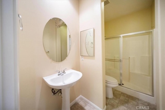 391 Camino Carta, San Marcos, CA 92078 - bathroom featuring a shower stall, baseboards, and toilet
