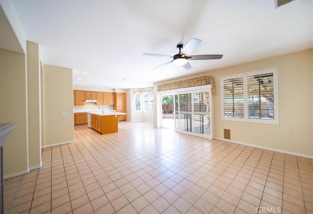 391 Camino Carta, San Marcos, CA 92078 - unfurnished living room with a sink, ceiling fan, baseboards, and light tile patterned floors