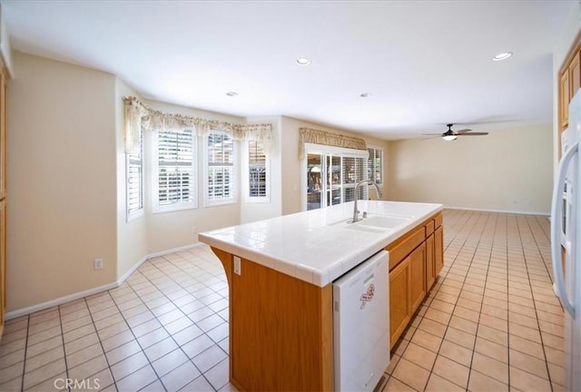 391 Camino Carta, San Marcos, CA 92078 - kitchen with a sink, tile counters, white appliances, and light tile patterned flooring