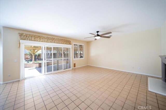 391 Camino Carta, San Marcos, CA 92078 - unfurnished room with light tile patterned floors, baseboards, and a ceiling fan
