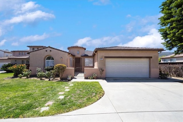 391 Camino Carta, San Marcos, CA 92078 - mediterranean / spanish house featuring concrete driveway, stucco siding, a front lawn, a tile roof, and a garage