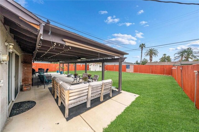 view of yard with a patio, a fenced backyard, and outdoor dining space