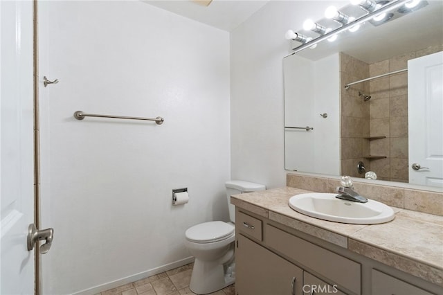bathroom with baseboards, walk in shower, toilet, and vanity