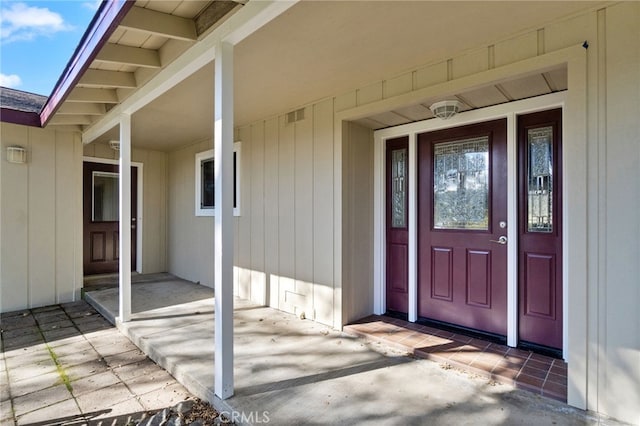 property entrance with crawl space and visible vents