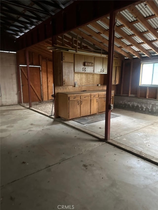 miscellaneous room featuring unfinished concrete flooring