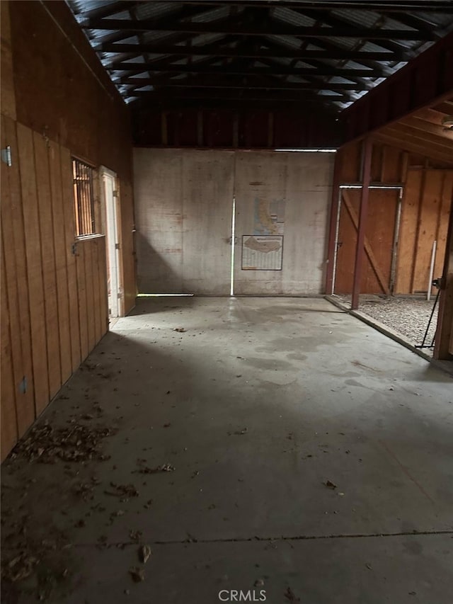 interior space featuring concrete flooring and a garage