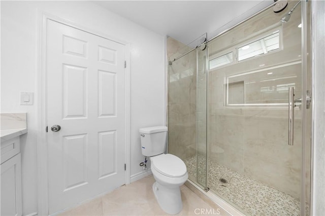 24812 Elena Dr, Laguna Hills, CA 92653 - full bathroom with a shower stall, toilet, tile patterned flooring, and baseboards