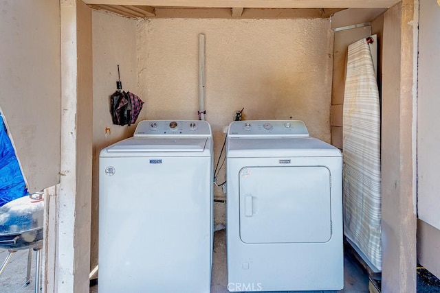 laundry area featuring laundry area and separate washer and dryer