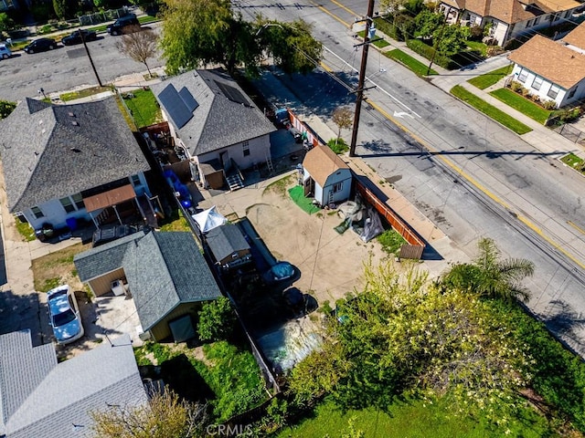 birds eye view of property with a residential view