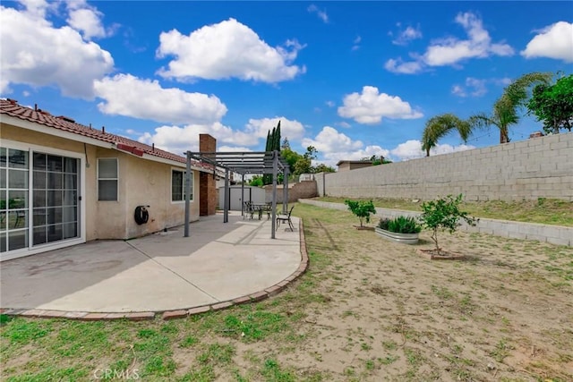 view of yard featuring a patio, a fenced backyard, and a pergola