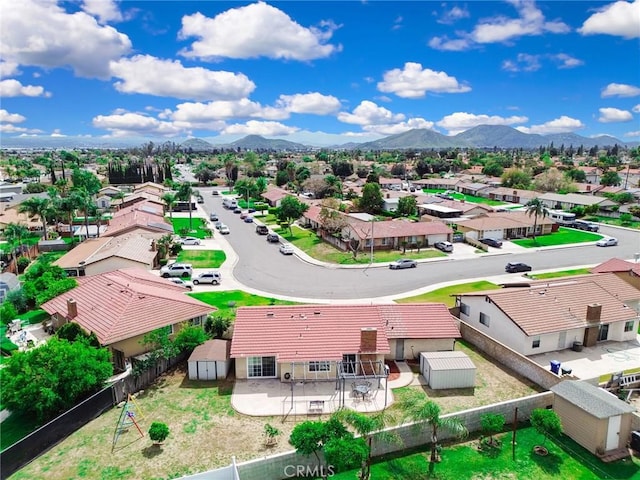 drone / aerial view with a residential view and a mountain view