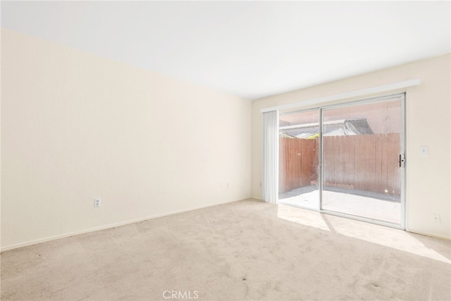 spare room featuring carpet