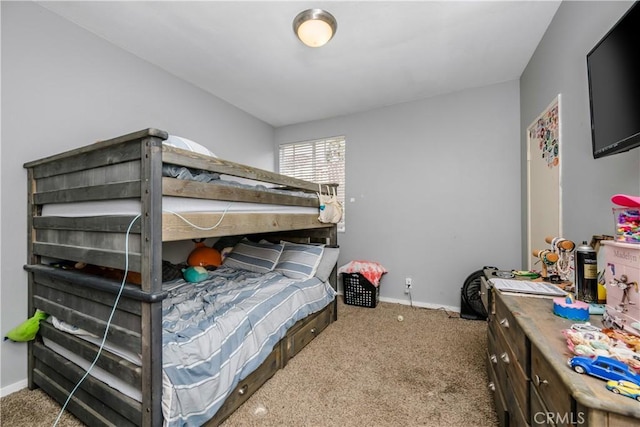 bedroom featuring carpet flooring and baseboards