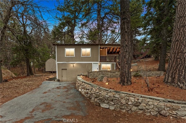 31662 Panorama Dr, Running Springs, CA 92382 - view of front of house featuring a balcony and asphalt driveway