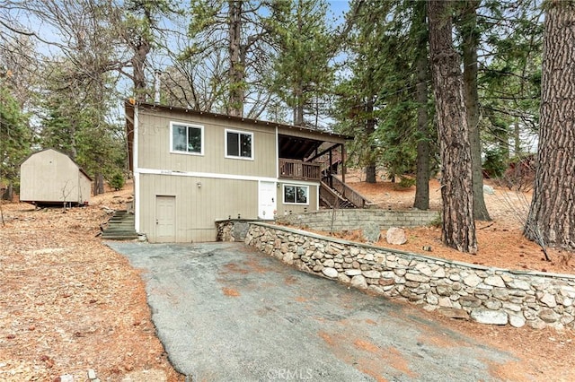 31662 Panorama Dr, Running Springs, CA 92382 - rear view of house with stairway and driveway