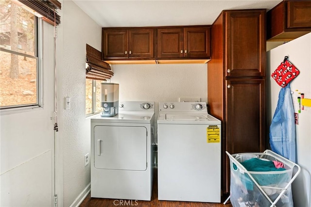 31662 Panorama Dr, Running Springs, CA 92382 - washroom featuring washing machine and clothes dryer, cabinet space, a textured wall, and wood finished floors