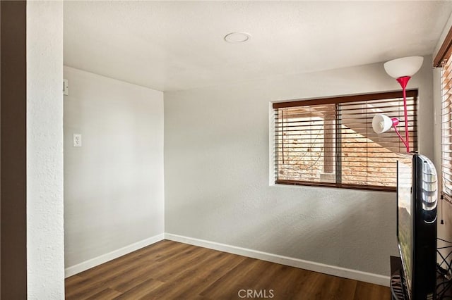 31662 Panorama Dr, Running Springs, CA 92382 - spare room with baseboards, wood finished floors, and a textured wall