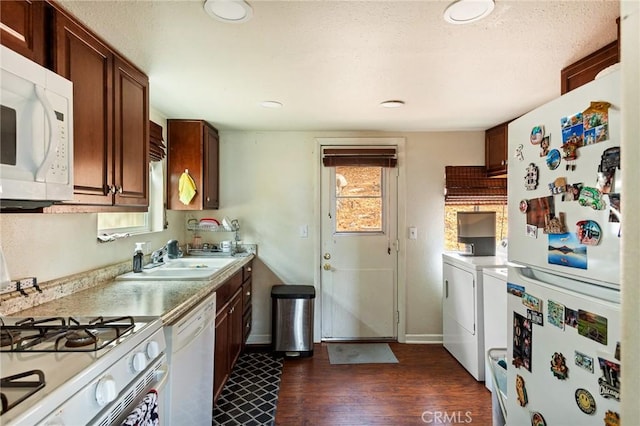 31662 Panorama Dr, Running Springs, CA 92382 - kitchen featuring white appliances, washing machine and clothes dryer, a sink, dark wood-style flooring, and light countertops