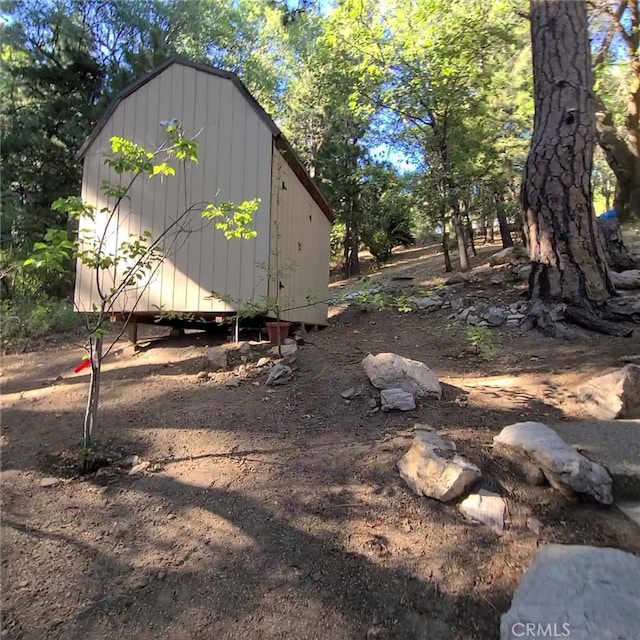 31662 Panorama Dr, Running Springs, CA 92382 - view of yard featuring an outdoor structure and a shed