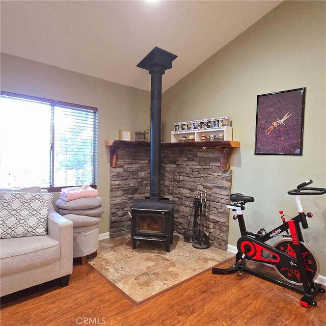31662 Panorama Dr, Running Springs, CA 92382 - living room featuring wood finished floors, a wood stove, baseboards, and lofted ceiling