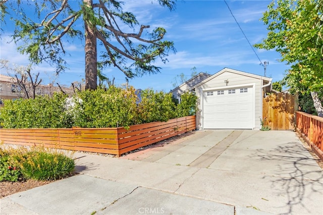 1012 S 11th St, San Jose, CA 95112 - garage with concrete driveway and fence