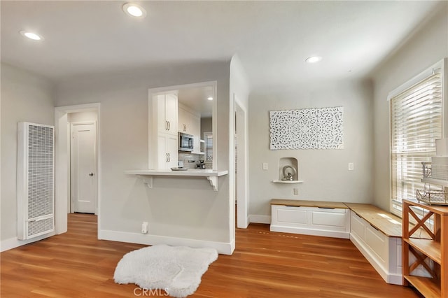 1012 S 11th St, San Jose, CA 95112 - interior space with a heating unit, white cabinetry, light wood-style flooring, plenty of natural light, and recessed lighting